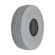 Close-up of the 4.10/3.50-4 Foam-Filled Mobility Tire with C189 Sawtooth Tread, showcasing its detailed synthetic rubber texture and central hole, designed for mobility scooters and power wheelchairs.