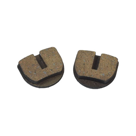 Rounded Brake Pads for Standard & YK2 Flame Calipers (Set of 2) shown in close-up, highlighting their durable sintered design with embedded copper flecks for enhanced longevity and wet performance, suitable for DIY electric dirt bike repairs.