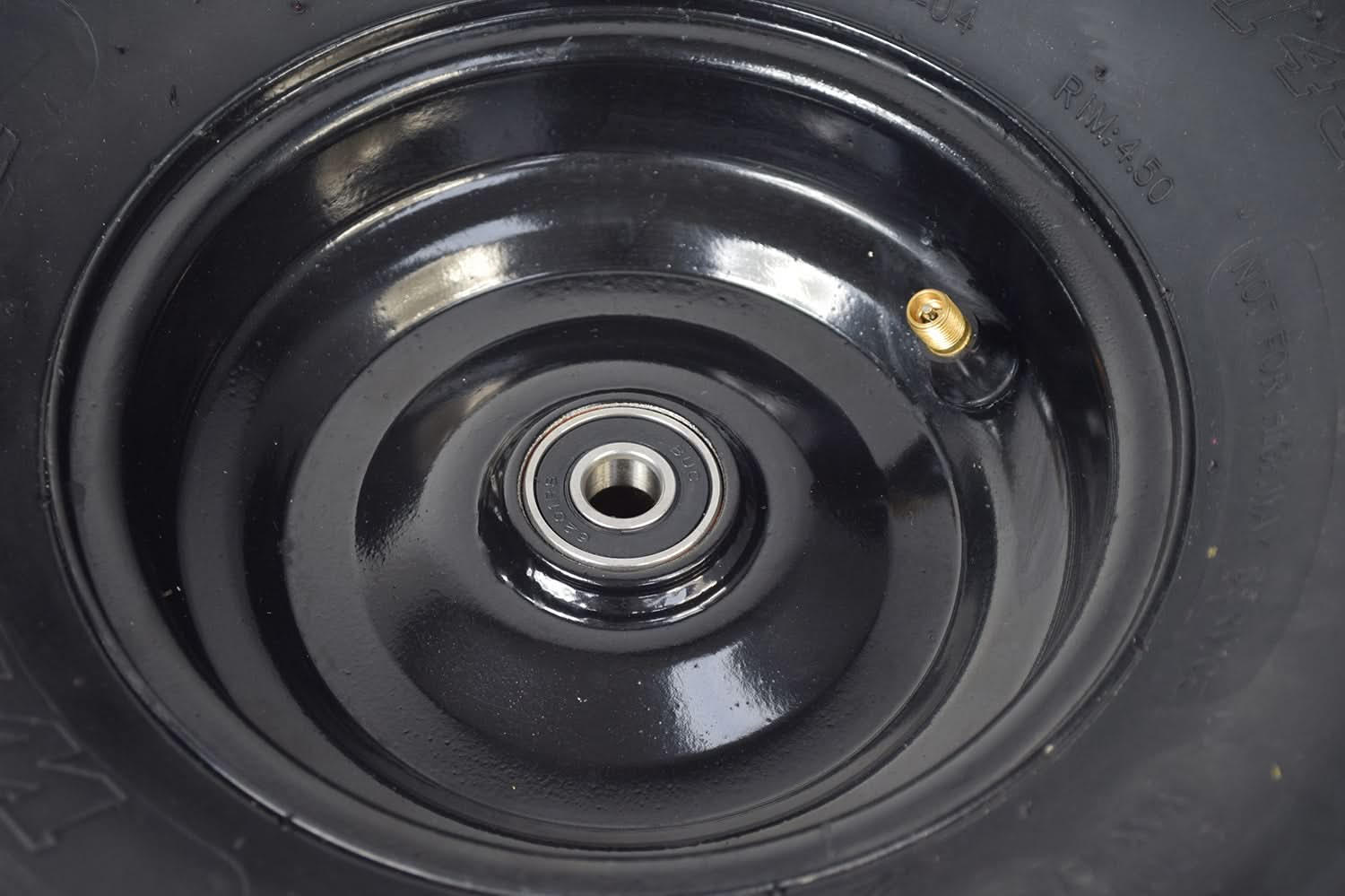 Front Left Wheel Assembly with Rim & Tire for Coleman KT196 & CK196 196cc 6.5 Hp Go-Karts, featuring a black tire with a visible hole. The assembly includes a 145/70-6 steel rim with V-tread.