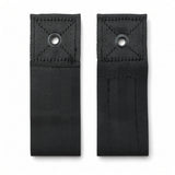 Two black wheelchair positioning belt mounting tabs with metal grommets (7/16" hole) and X-stitched webbing for bolting to the seat frame