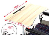 Wood Veneer Tray Table for Wheelchairs with a woodgrain laminate surface, folding steel supports, and mounting clamps. Measurements and a close-up of the handle are visible.