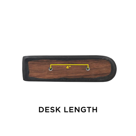 Black Vinyl Co-Molded Armrest Pad for Pride Scooters shown on a wooden surface with a yellow line, featuring a square end and a round end, designed to fit over the armrest weldment.